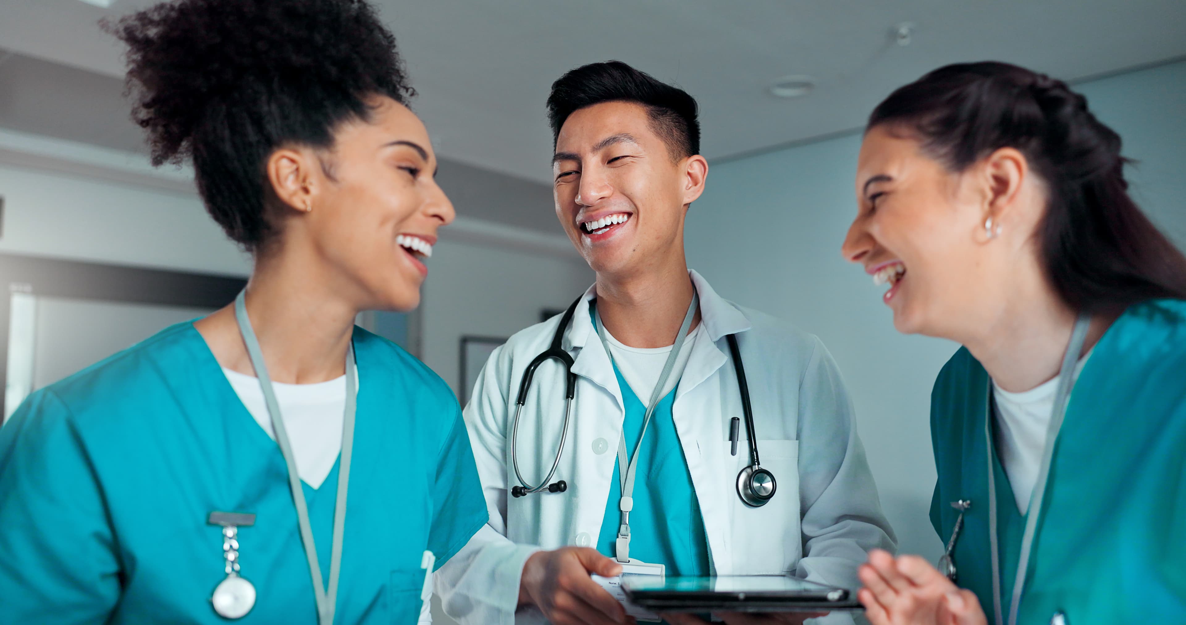 PMHNP-BC Certification Exam Preparation PMHNP-BC (Psychiatric Mental Health Nurse Practitioner – Board Certified) exam prep - a clinical team collaborating on a tablet in a hospital | Psychiatric Mental Health Review