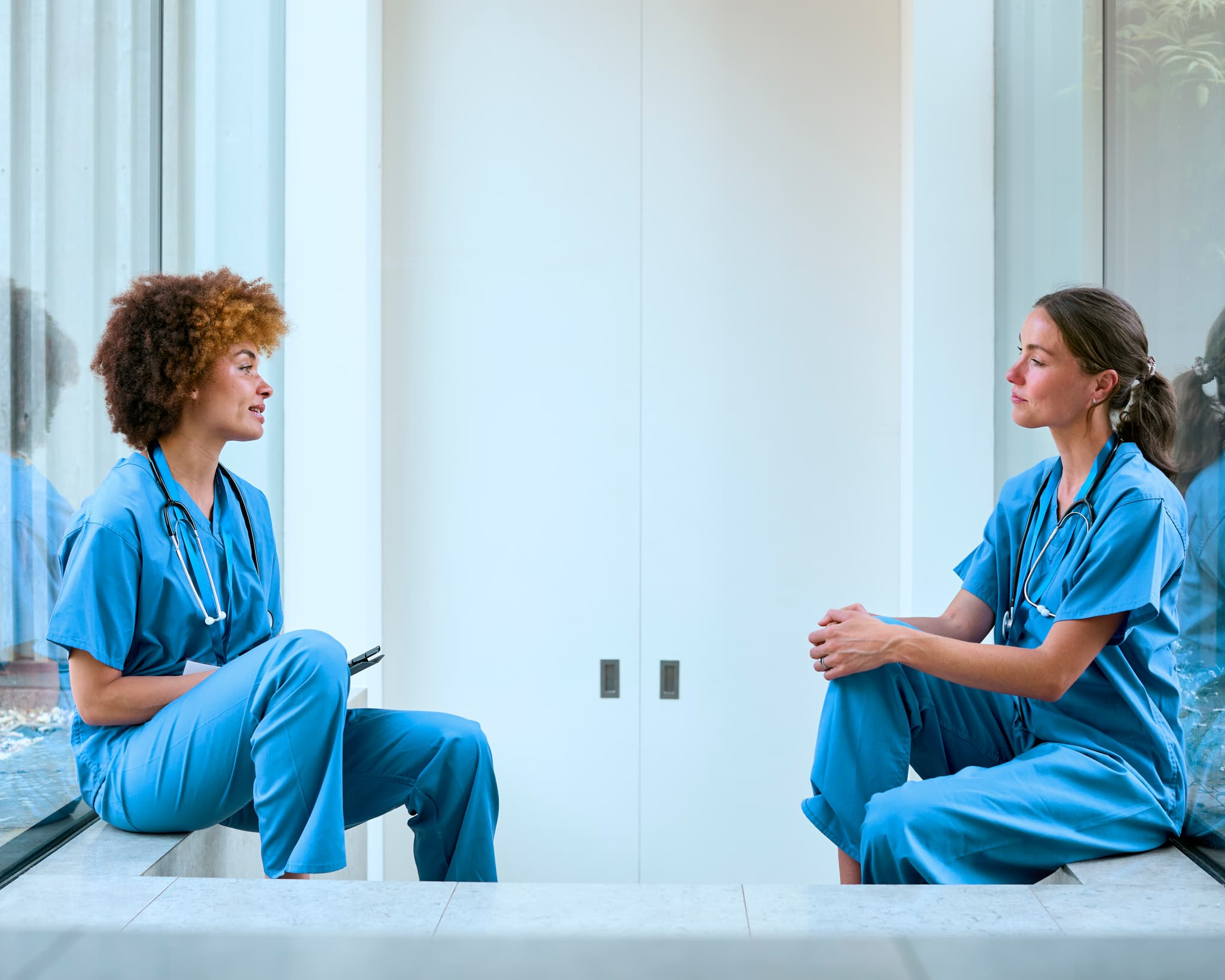 Your Path to PMHNP-BC Certification Psychiatric Mental Health Review - two clinicians taking a break together, PMHNP-BC exam preparation