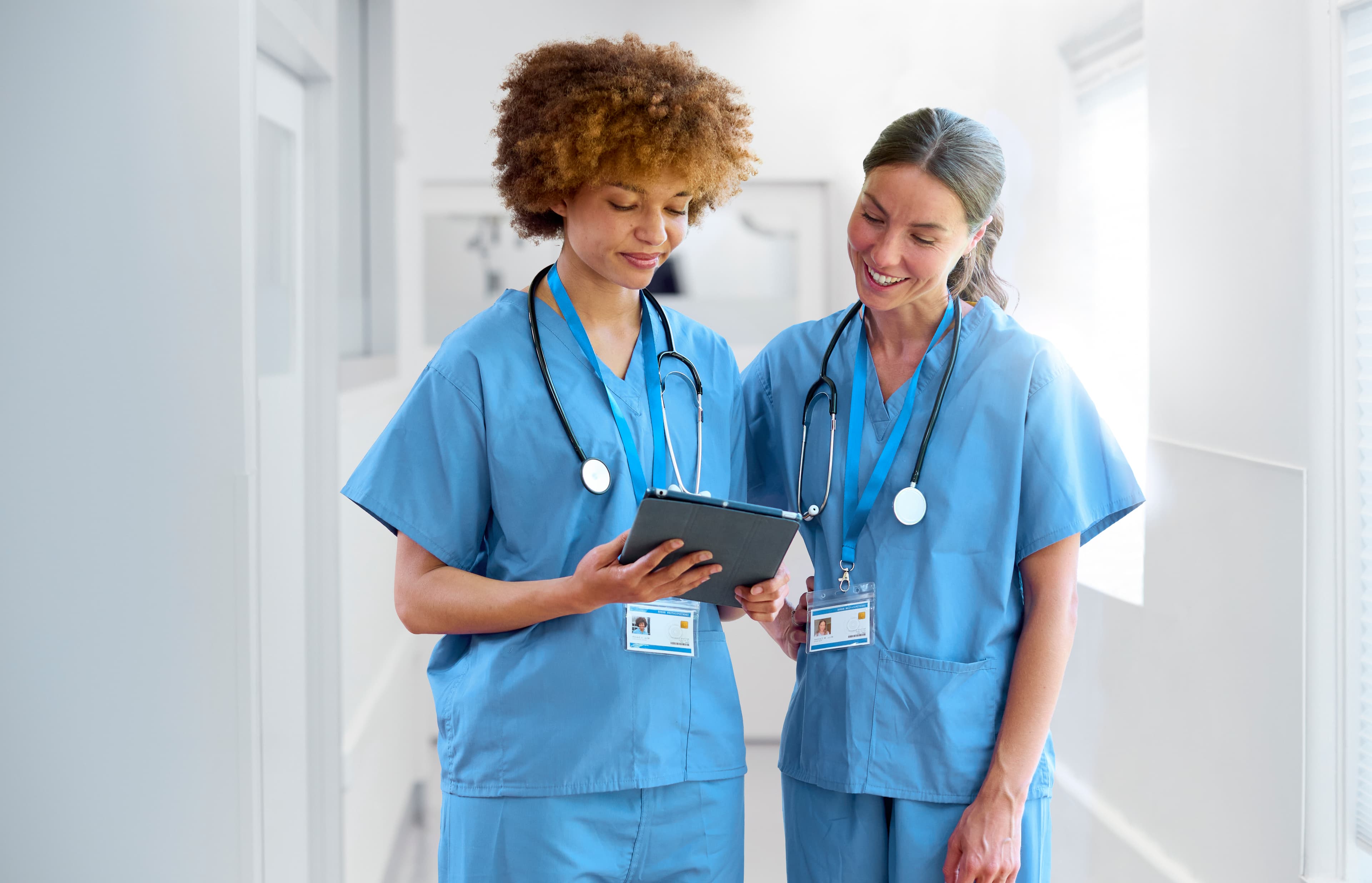 PMH-BC Certification Exam Preparation PMH-BC (Psychiatric-Mental Health Nurse – Board Certified) exam prep - two clinicians reviewing patient information on a digital tablet | Psychiatric Mental Health Review